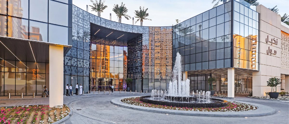 The mall's glass entrance and fountain on the Palm's trunk