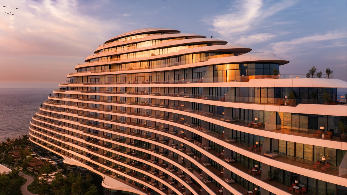 Close aerial view of Jumeirah Marsa Al Arab's stepped terraces lit by the setting sun