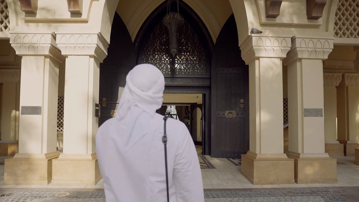 A brand film following a photographer through Palace Downtown's lobby, lakeside terraces and courtyard pools, with couples by the water and Burj Khalifa.
