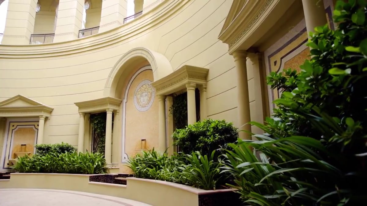 A film of Palazzo Versace Dubai's courtyard, chandeliers, banquet tables and boardroom
